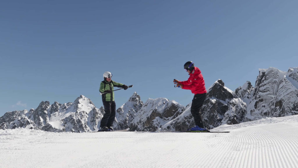 individual to success the of advantages private lessons. Ski instructor explaining body position on skis